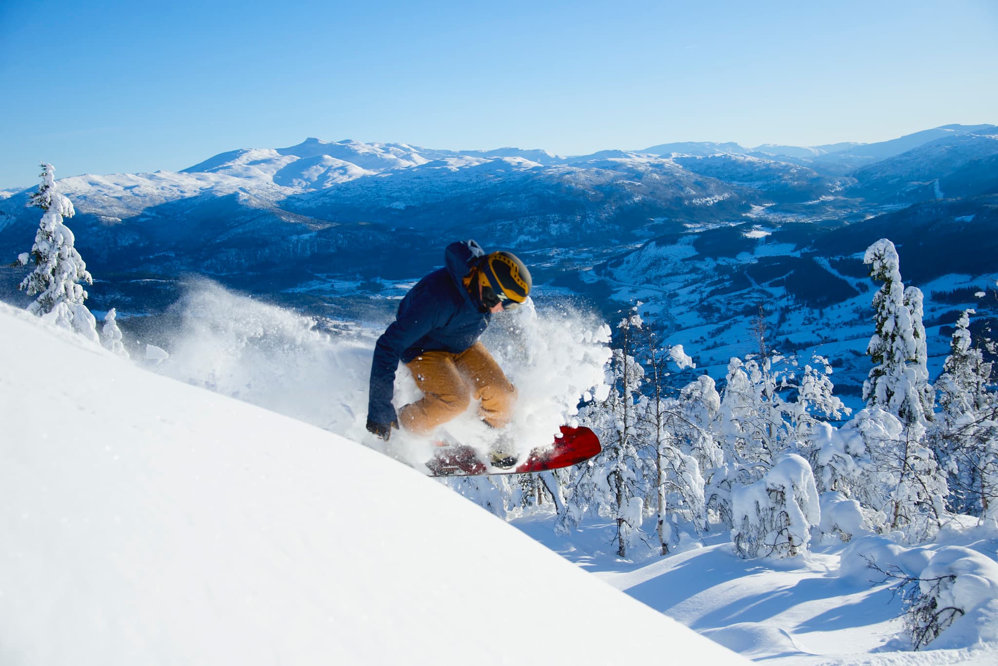 A snowboard blasts through the powder in the Norway ski resort of Voss